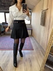 Pleated black skirt with button detail