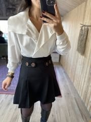 Pleated black skirt with button detail